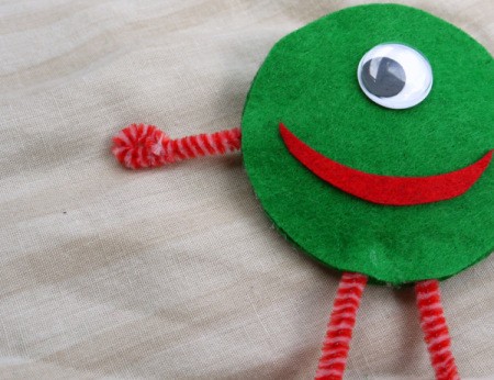 One Eyed Monster Badge - curl the ends of the arms to make hands