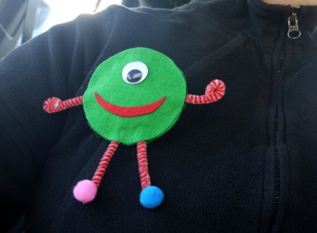 One Eyed Monster Badge - badge pinned on