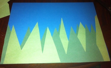 Spring Day Project Using Stickers - cut tall grass blades from both shades of paper and glue to blue piece