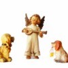 An angel figurine with two dog figurines.