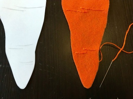 Felt Carrot Money Pocket - closeup of stitching near bottom of carrot