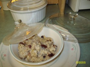 An old casserole lid covering a plate of leftovers.