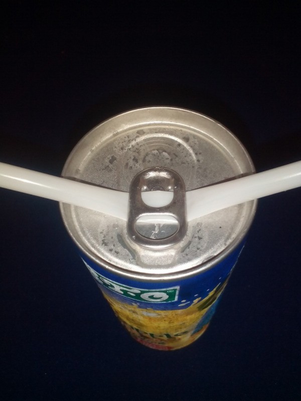 A straw placed under a ring tab.