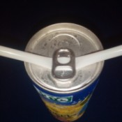 A straw placed under a ring tab.