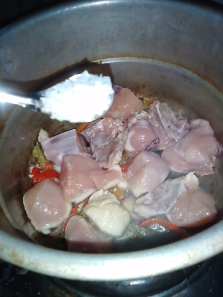 salt added to chicken, peppers and onion