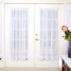 French doors with sheer window curtains.