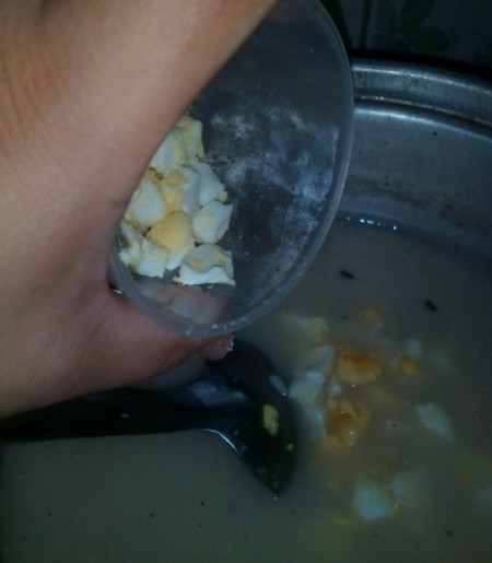 Adding ingredients to porridge.