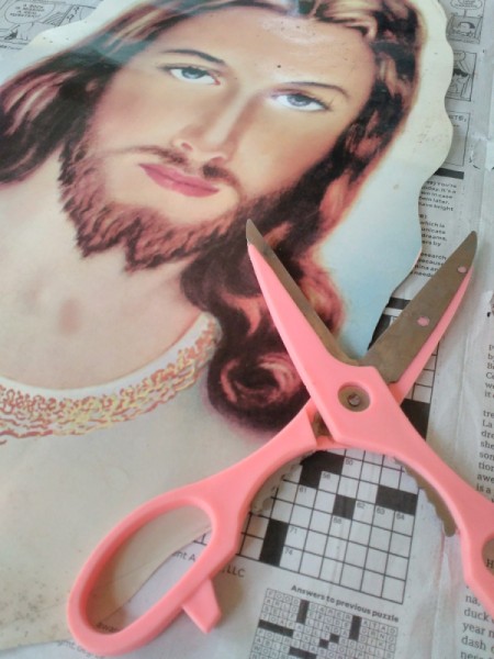 Decorating Door Poster with Ribbons - cutting away advertising and retaining religious image only