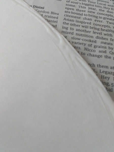 Decorating Door Poster with Ribbons - closeup of glue along the edge of the oval