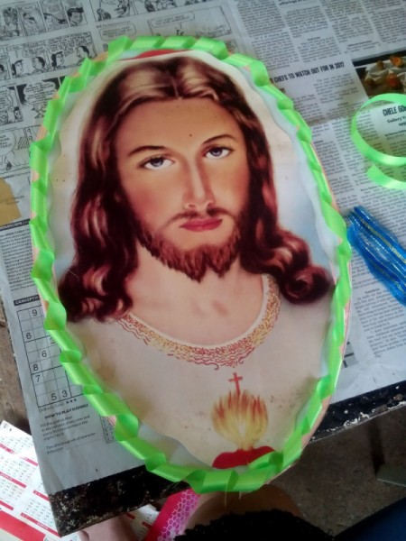 Decorating Door Poster with Ribbons - religious image glued down in center of oval