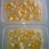 pudding in small containers with corn and cheese on top