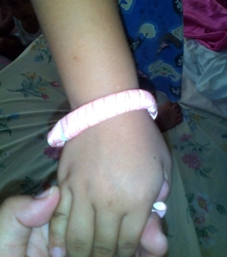 Toothbrush Bracelet - brush bracelet wrapped with ribbon on child's wrist