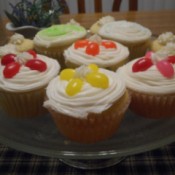 Cupcakes with jellybeans decorating the tops in a flower pattern.