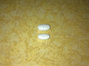 Two pills that look very similar.