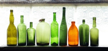 A row of old glass bottles.