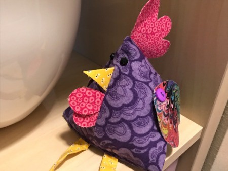 Fabric Chicken Doorstop - chicken sitting on corner of shelf
