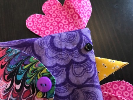 Fabric Chicken Doorstop - closeup of eye