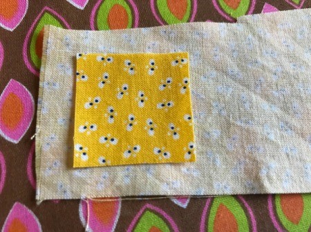 Fabric Chicken Doorstop - lay webbing side down on wrong side of beak fabric and press