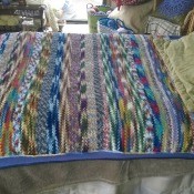 Recycled Yarn Afghan - side view of day bed with afghan