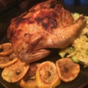 Moroccan Chickenon plate with lemon wedges