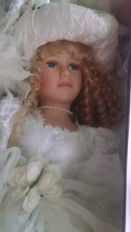 Value and Information for Porcelain Doll - closeup of face