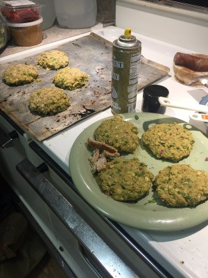 Caulitater Burger patties on plate and baking sheet