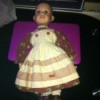 Identifying a Porcelain Doll - doll without wig in white and striped dress
