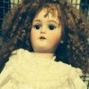 Finding the Value of an Antique German Doll - doll with curly dark hair