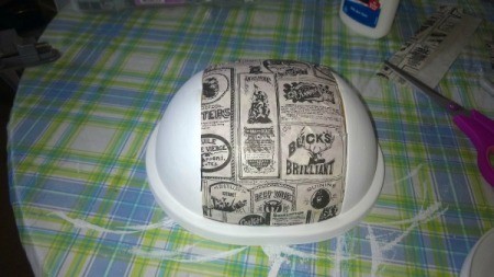 Refurbishing a Small Trash Can - glue decorative paper to swing top