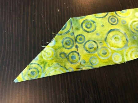 Clothespin Apron  - marking the straight cut line on the end of the bias strips