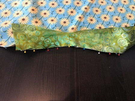 Clothespin Apron - pin the right side of the binding to the pocket opening