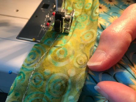 Clothespin Apron - stitching the binding to the pocket edge
