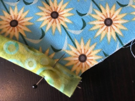 Clothespin Apron fold the binding over the seam and pin in place