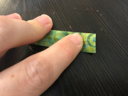 Clothespin Apron - cut a narrow length of the batik to use in making a hanger, then fold in half and finger press along the center