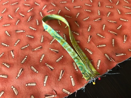 Clothespin Apron - fold hanger in half and pin to the apron back with loop away from the seam