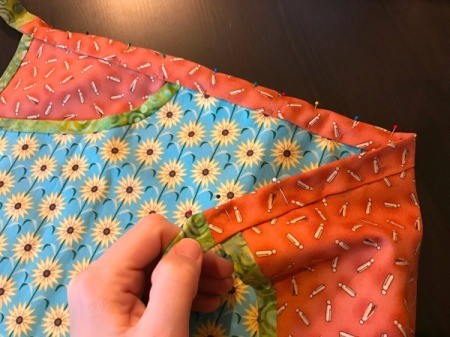 Clothespin Apron - fold waistband to the back along the center and pin in place