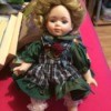 Identifying a Porcelain Doll - wearing green dress with plaid apron