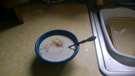 A bowl of food inserted into a second empty bowl.