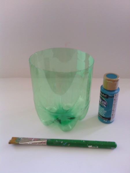 Soda Bottle Bird Feeder - bottom with a bottle of blue paint and a brush