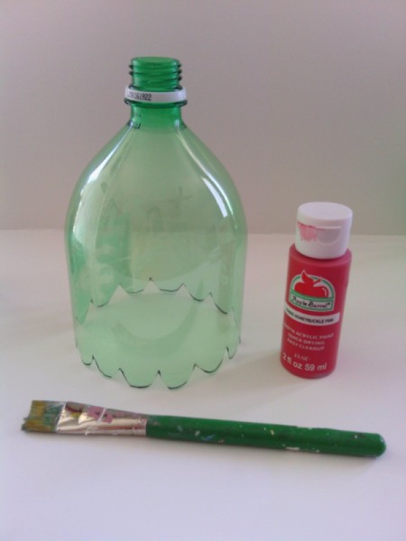 Soda Bottle Bird Feeder - top with a bottle of red paint and a brush