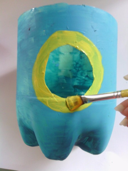 Soda Bottle Bird Feeder - paint around the opening