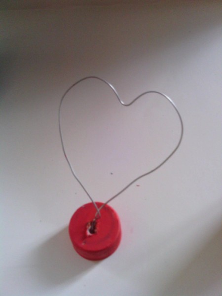 Soda Bottle Bird Feeder - wire shaped into a heart
