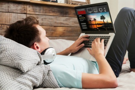 A man watching a video through a streaming service.