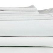 A set of white bedsheets, folded.