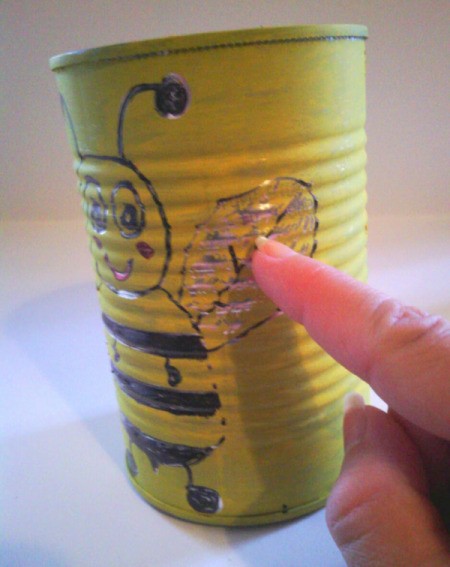Recycled Bumblebee Can - scratching off some of the paint to reveal the metal beneath