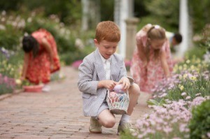 Children hunting for eggs after church on Easter.