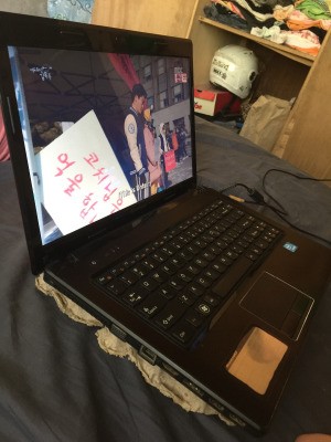An egg carton underneath a laptop to help with ventilation.