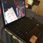 An egg carton underneath a laptop to help with ventilation.