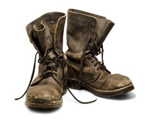A pair of old boots on a white background.