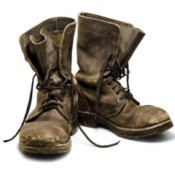 A pair of old boots on a white background.